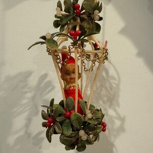 Vintage Elf Holiday Ornament with Greenery and Red Accents